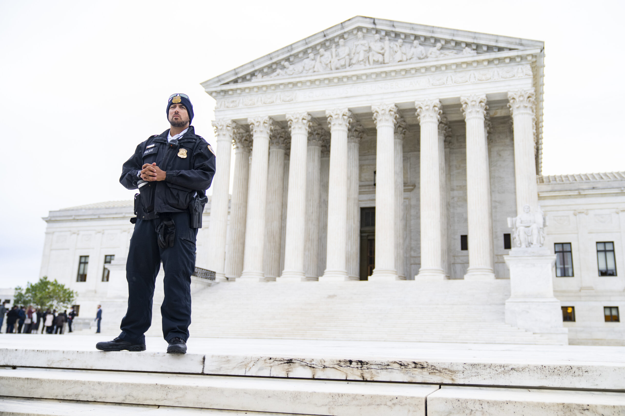 UNITED STATES - OCTOBER 3: A police officer is seen outside of the U.S. Supreme Court as it begins a new term on Monday, October 3, 2022. Members of the public were allowed in to hear the court's arguments that had been closed since March 2020 due to the coronavirus pandemic.