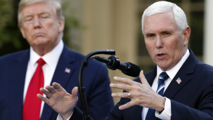 Donald Trump glaring at Mike Pence