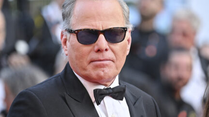 David Zaslav wearing a tuxedo and sunglasses