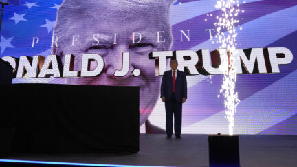 Former President Donald Trump arrives on stage at the Turning Point Action conference, Saturday, July 15, 2023, in West Palm Beach, Fla