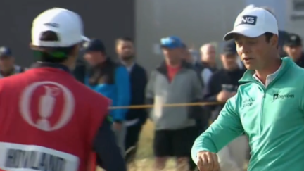 Viktor Hovland reacts to a bird pooping on his arm